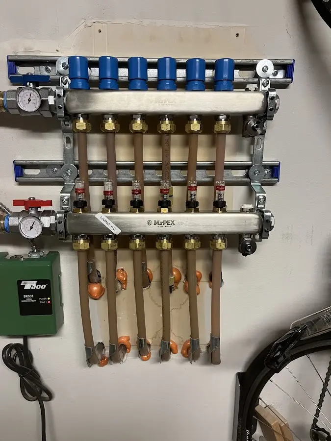 Plumber performing Water Heater Repair at a residential property in Wilton